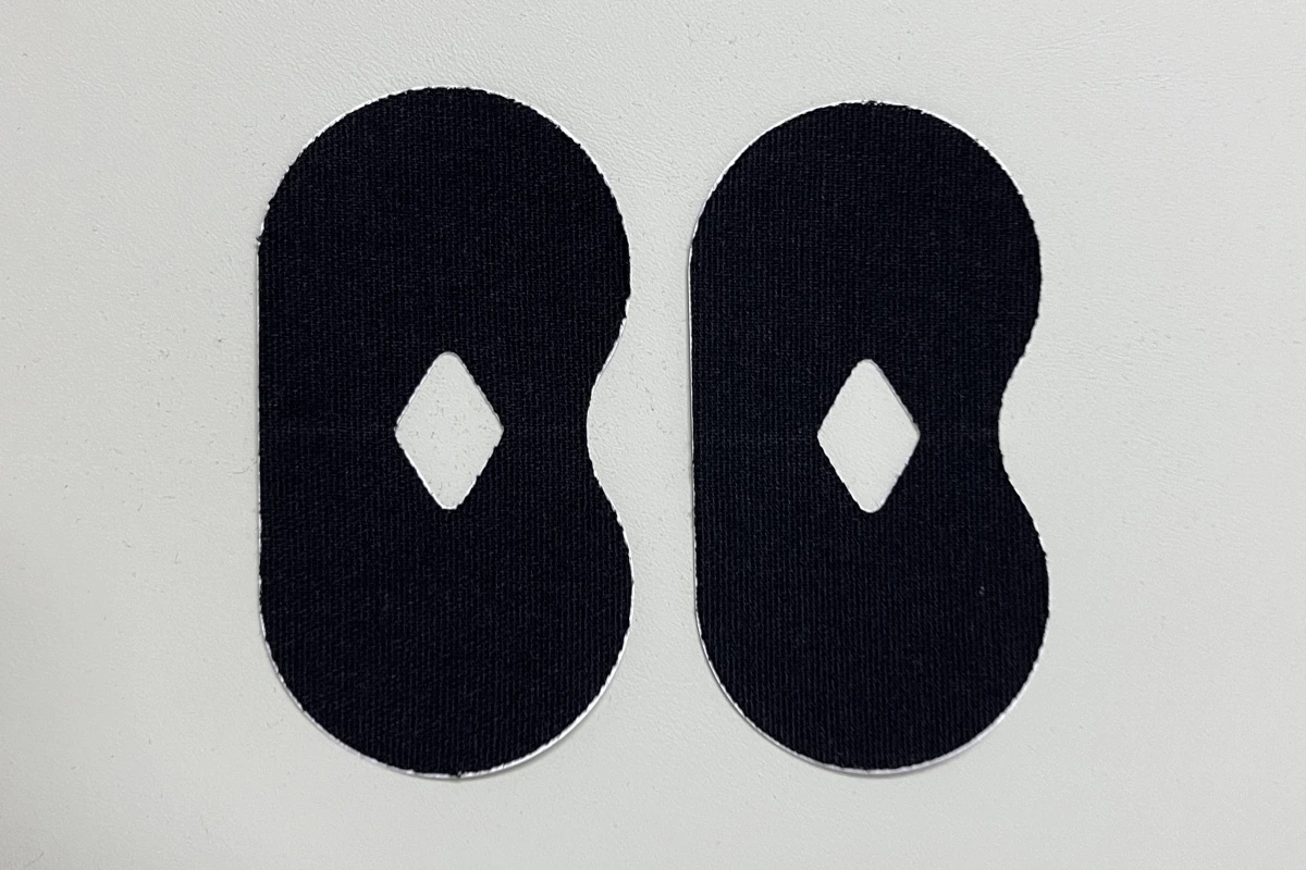 Black H-shaped mouth tape patches with a central cut-out
